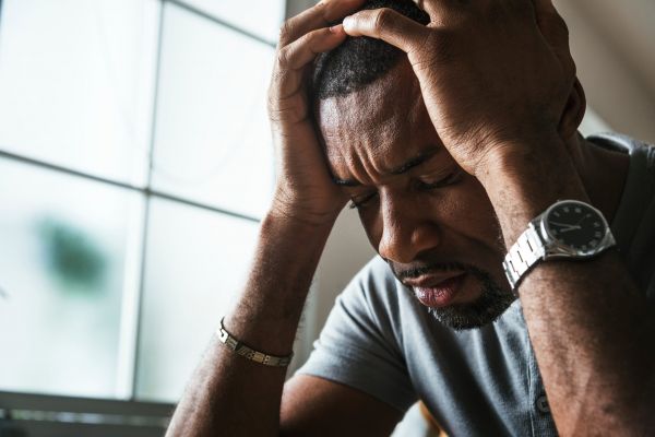 A man suffering from schizophrenia, looking for relief through Empowered Behavioral Health.
