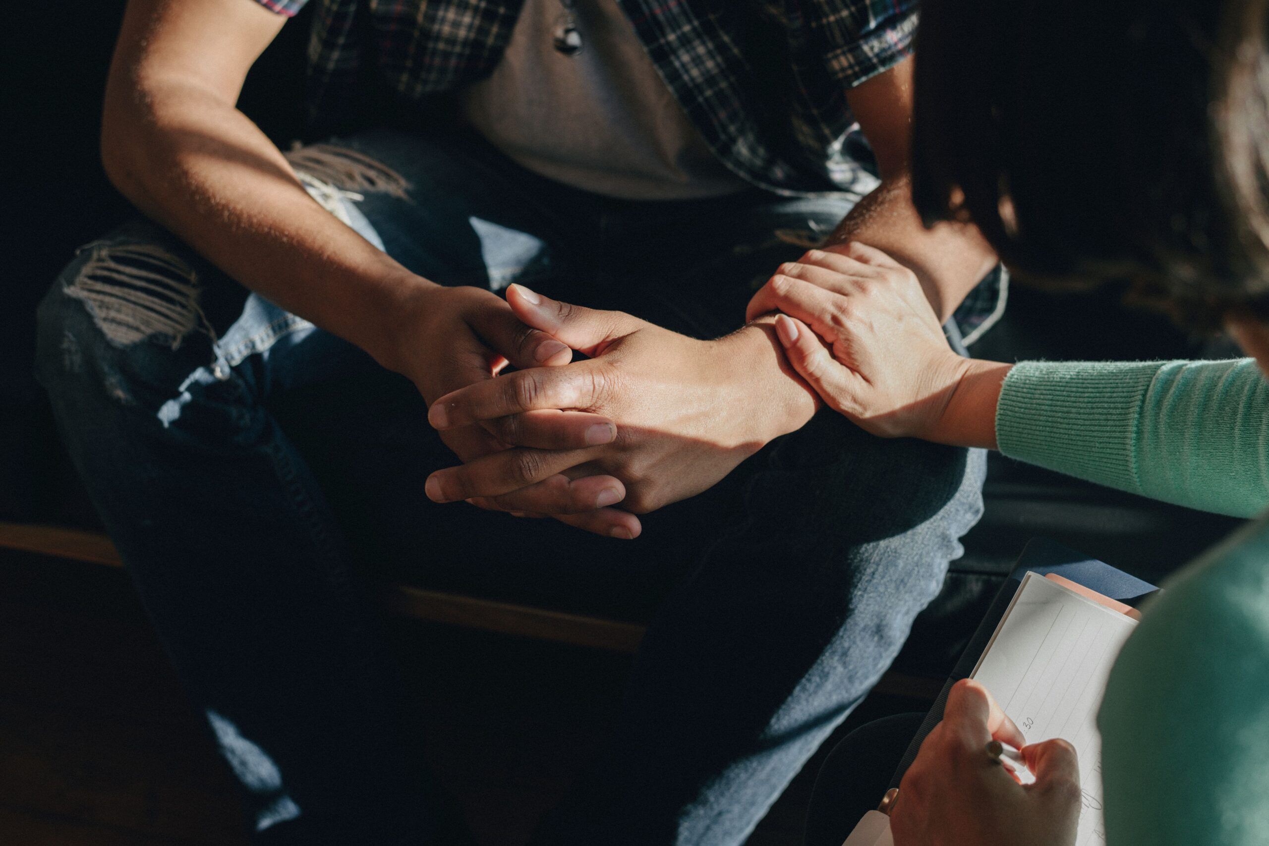 therapist reaching out to client