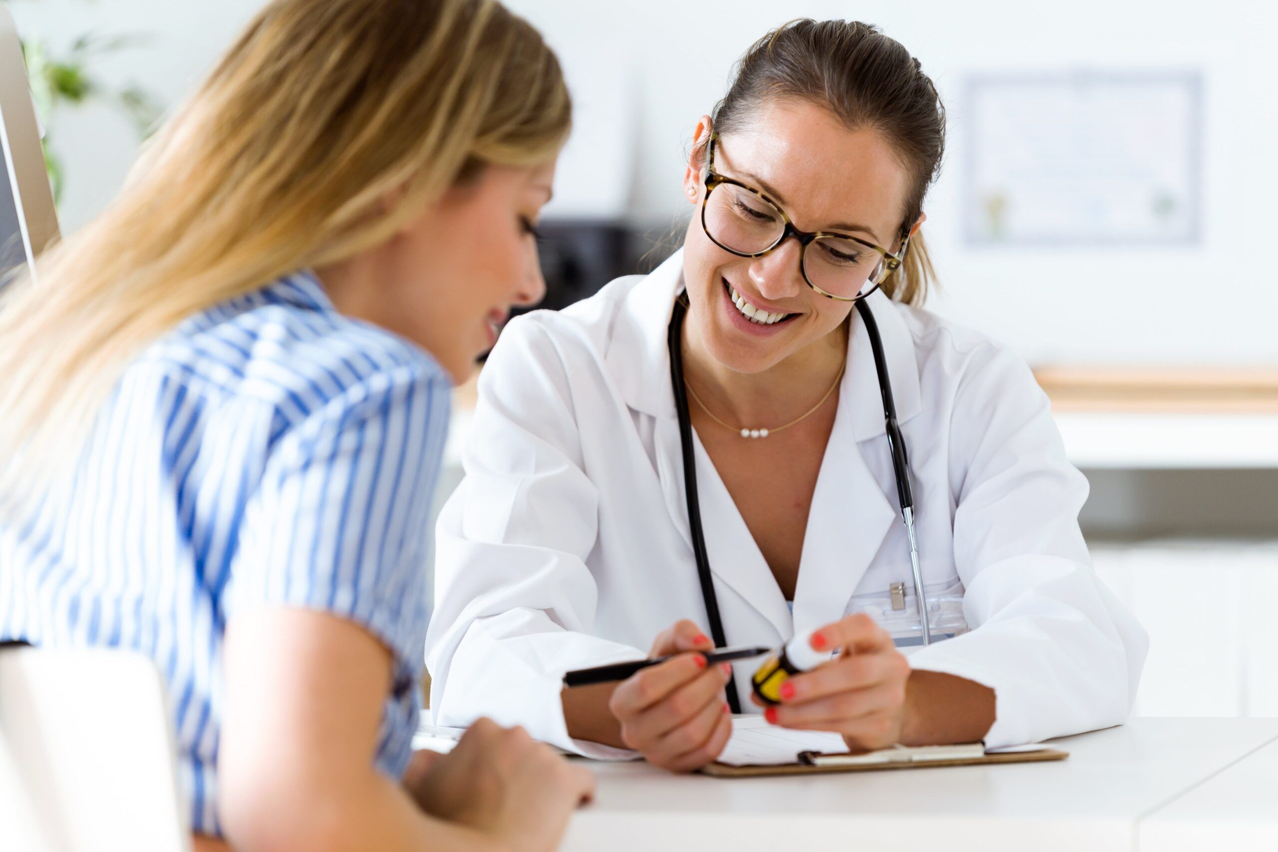 doctor helps client manage medications